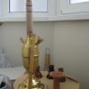 Brass and wooden goza